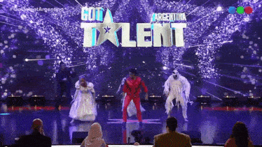 a group of people on a stage in front of a sign that says " got talent "