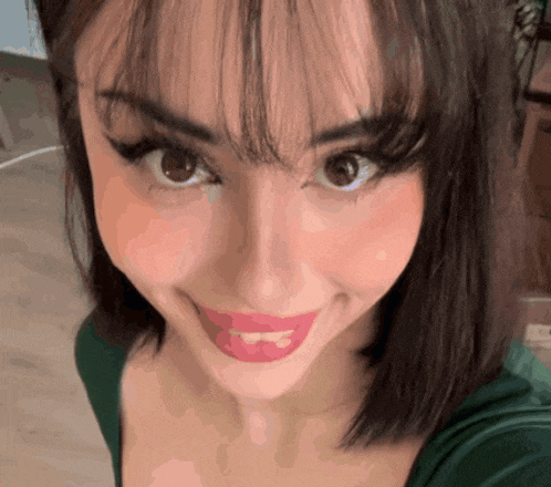 a close up of a woman taking a selfie