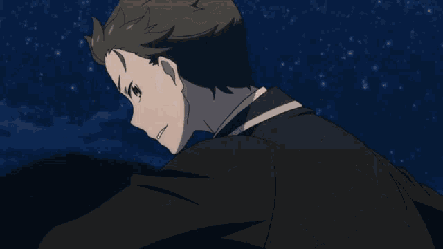 a man in a tuxedo is pointing at something with a yellow star in the background