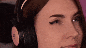 a close up of a woman wearing headphones with the letter o on the side