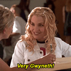 two women are sitting at a table and one of them is saying very gwyneth