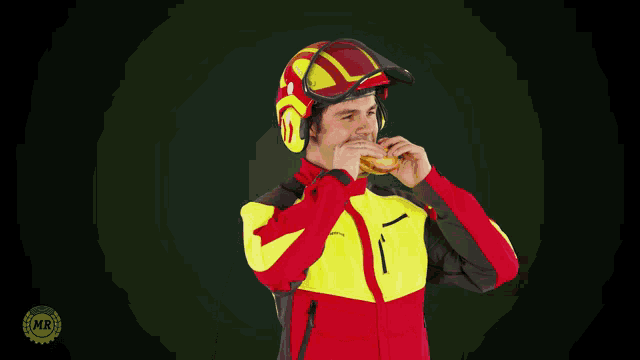 a man wearing a helmet and a jacket that says mr on the bottom right