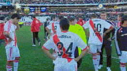 a soccer player with the number 34 on his back stands on the field