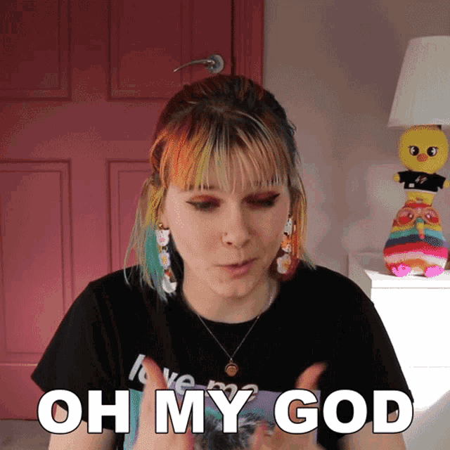 a girl with rainbow hair says " oh my god "