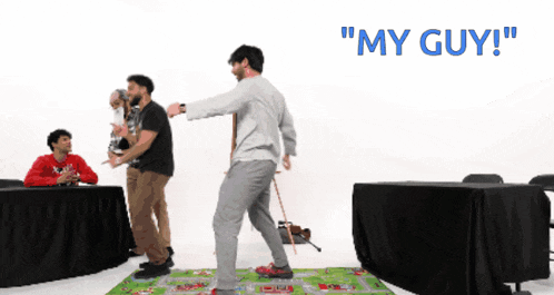 a group of men are playing a game with the words " my guy " on the bottom