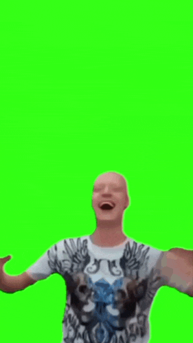 a man with a shaved head is wearing a t-shirt with wings on it .