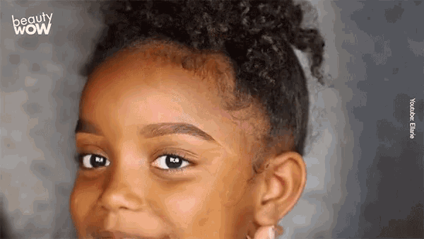 a close up of a little girl 's face with the words beauty wow written on the bottom