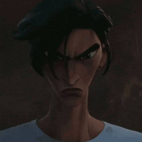a cat with an angry look on its face is behind a person