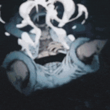 a blurry picture of a person 's face with smoke coming out of it
