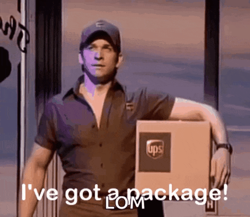 a man in a ups uniform is holding a ups package