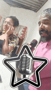 a man and woman singing into a microphone with a star behind them