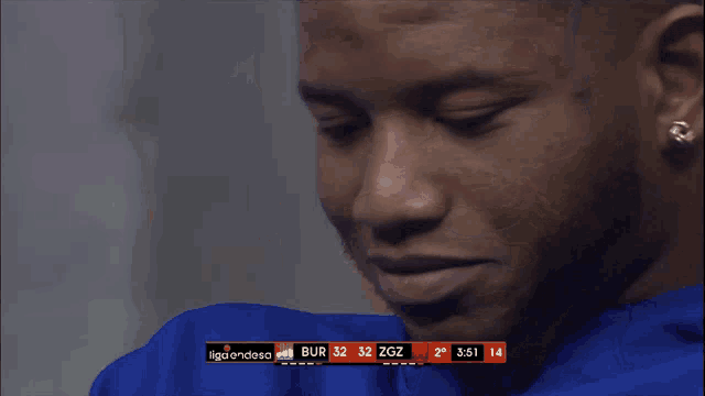 a close up of a person 's face with a scoreboard that says liga endesa on it