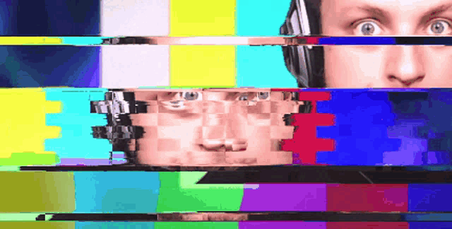 a man wearing headphones is looking at a colorful screen