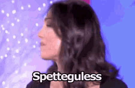 a close up of a woman 's face with the words spetteguless written on it