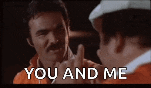 two men are talking to each other and one of them is pointing at the other with the words `` you and me '' .