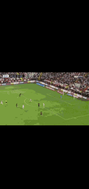 a soccer game is being played in a stadium with an advert for vivo on the sidelines