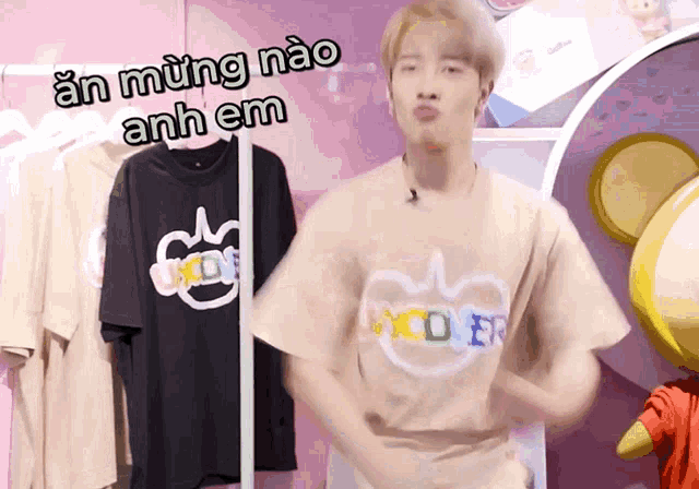 a man wearing a t-shirt that says mickey mouse