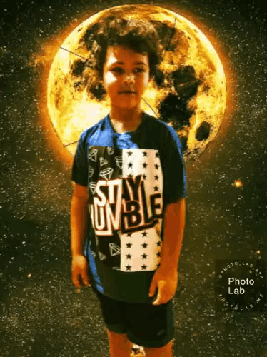 a boy wearing a shirt that says stay umble