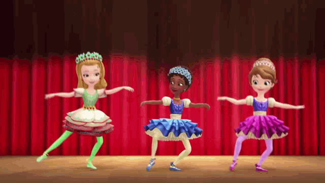 three cartoon ballerinas are dancing on a stage .