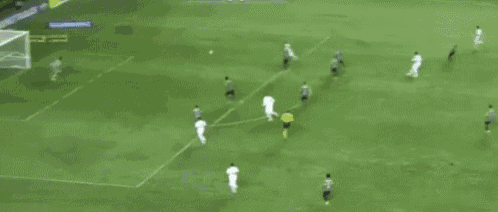 a blurry picture of a soccer player with the number 22 on his shirt