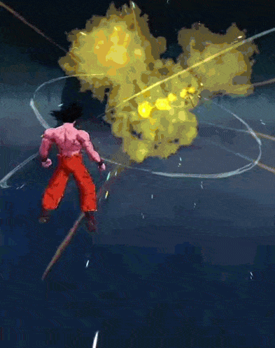 a man in red pants is standing in front of a huge explosion