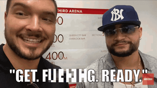 two men are standing in front of a sign that says " get full hg ready "