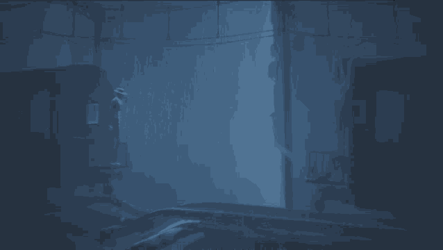 a dark room with a few lights shining through the walls