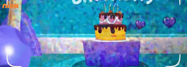 a birthday cake with candles on top of it is on a table .