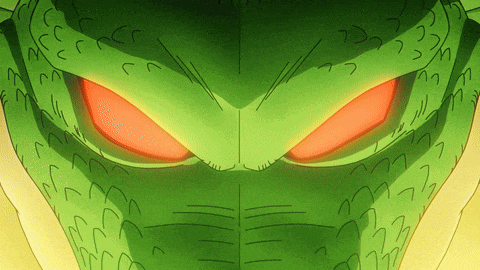 a close up of a green monster 's face with orange eyes