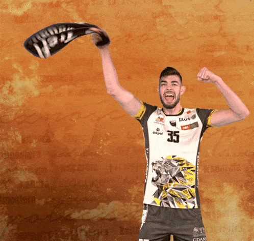 a man wearing a shirt with the number 35 on the front