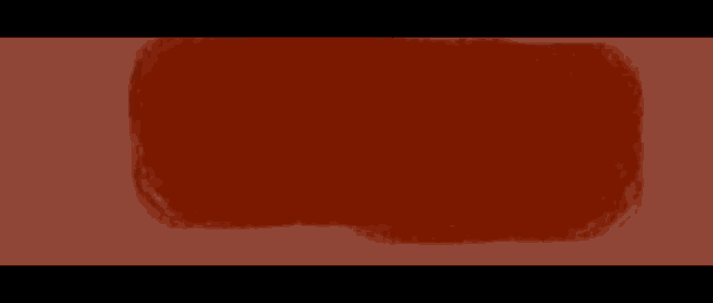 the letter w is on a red background with a brush stroke