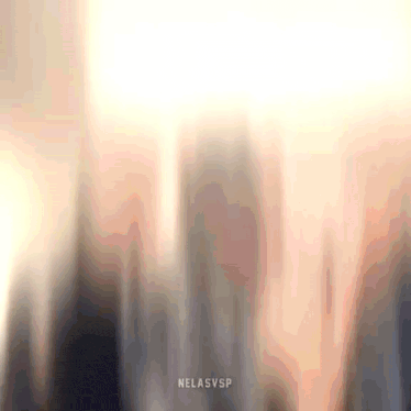 a blurred image of a city skyline with the words nelasvsp on the bottom .