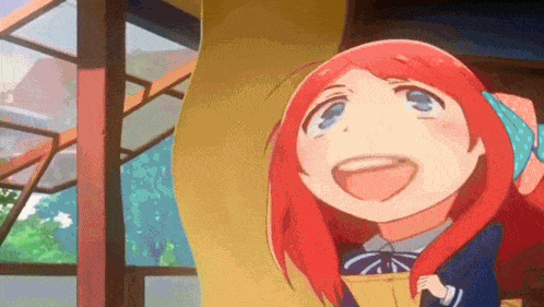 a girl with red hair and blue eyes is standing in front of a window with her mouth open .