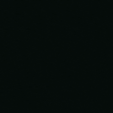 a red and yellow light is moving in a circle on a black background .