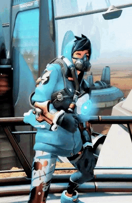 a person wearing a gas mask and a blue hoodie