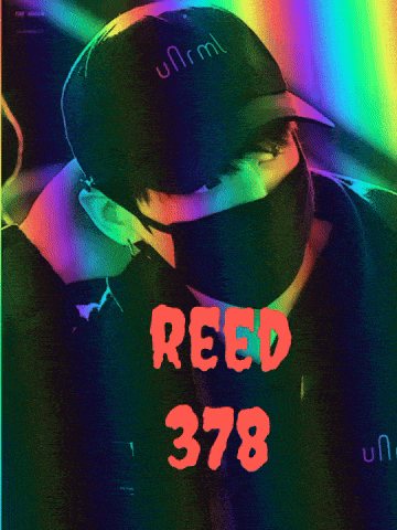 a man wearing a mask and a hat with reed 378 written on it
