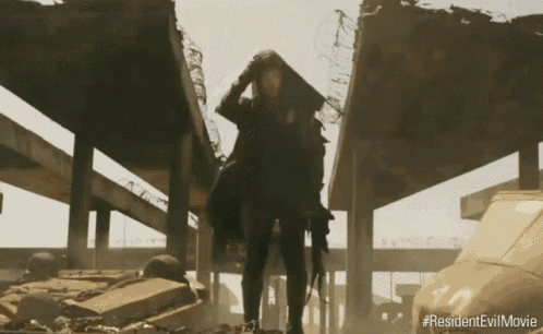 a man standing in a destroyed building with the hashtag #resident evil movie