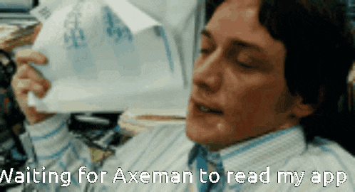 a man is holding a piece of paper with the words " waiting for axeman to read my app " below him