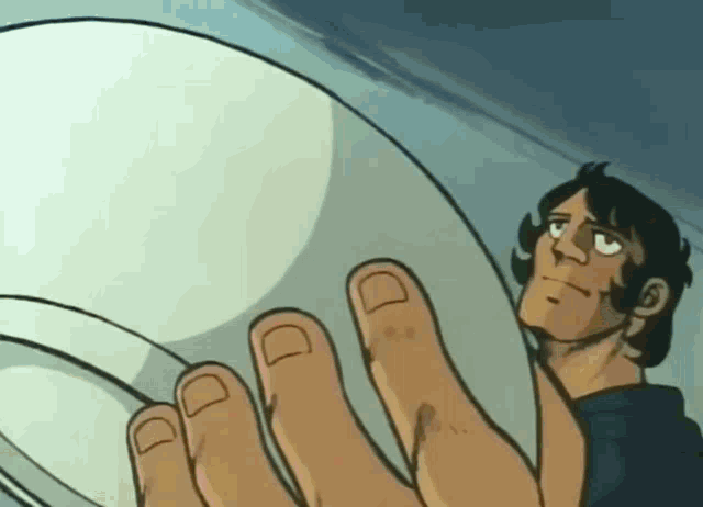 a man in a cartoon is holding a white object with his fingers
