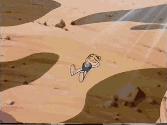 a cartoon character is laying down in the sand
