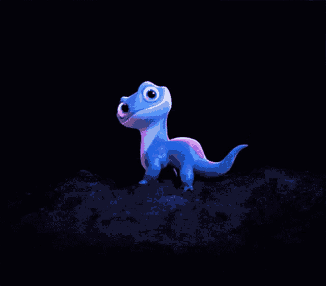 a blue lizard with its tongue out is standing on a rock
