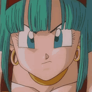 a close up of a cartoon character with green hair and blue eyes making a funny face .