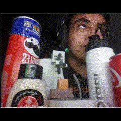a man wearing headphones is surrounded by condiments including pringles mayonnaise and a coke can
