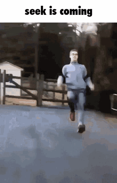 a man is running down a road with the words " seek is coming " below him