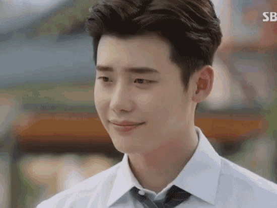 a close up of a man in a white shirt and tie .