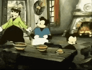 a group of cartoon characters are sitting around a table with bowls of food