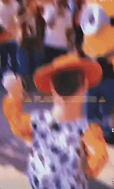 a blurry image of a cartoon character with the letter c on the bottom right