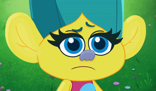 a cartoon character with big ears and blue hair looks sad