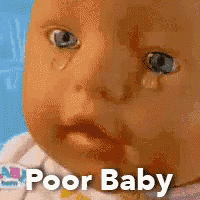 a baby doll with a tear coming out of it 's eye and the words poor baby written below it
