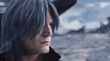 a man with long blue hair and a beard is standing in the desert .